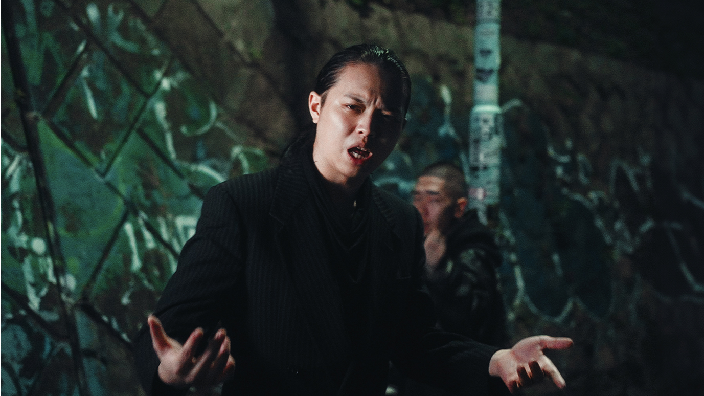 Graphic of a typography specimen showing the alphabet and numerals on top of a dark gray background.