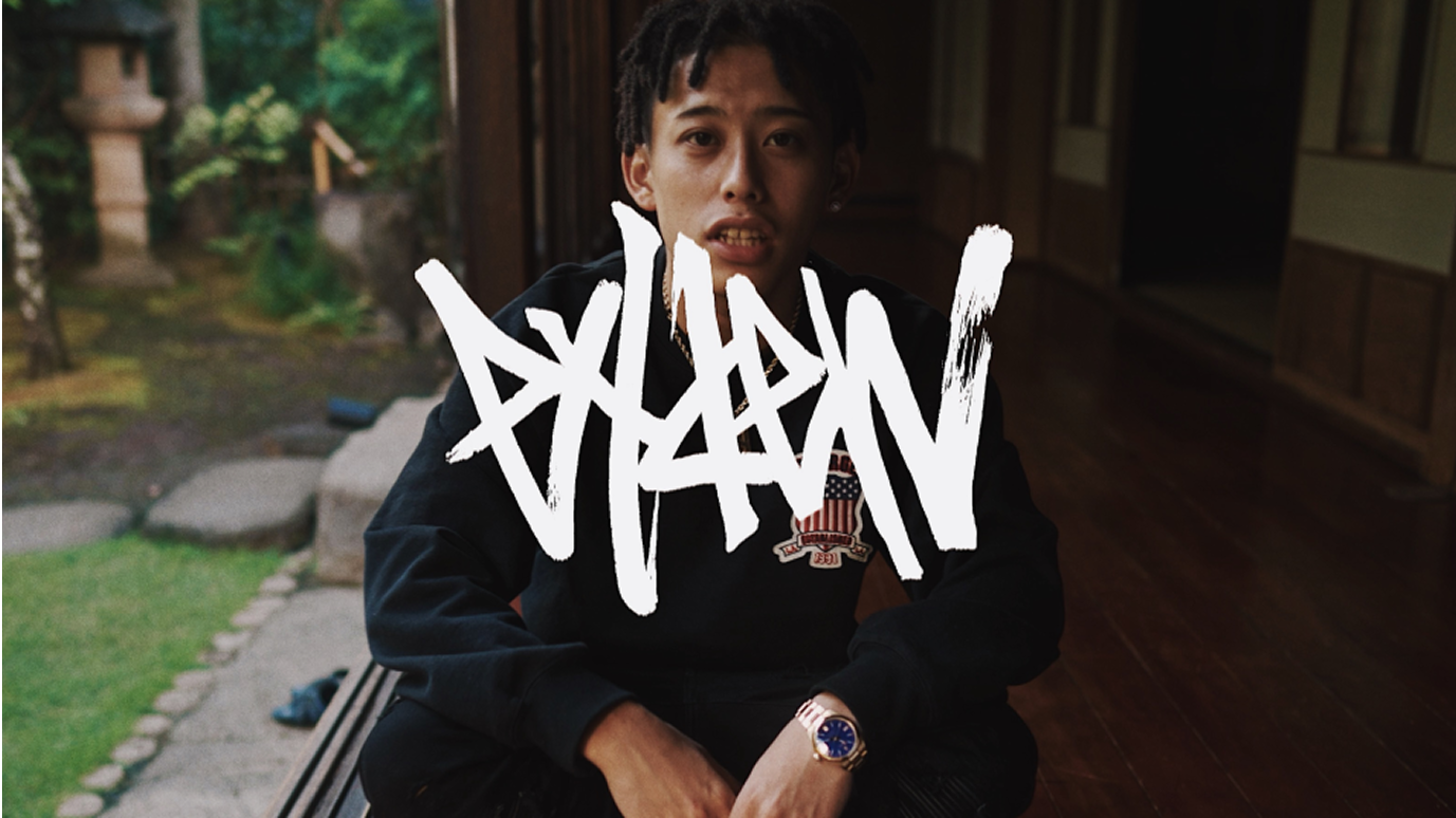 Graphic of a typography specimen showing the alphabet and numerals on top of a dark gray background.