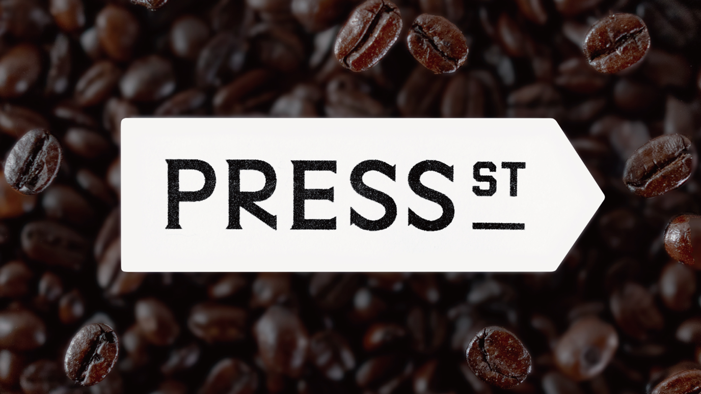 Graphic of a typography specimen showing the alphabet and numerals on top of a dark gray background.