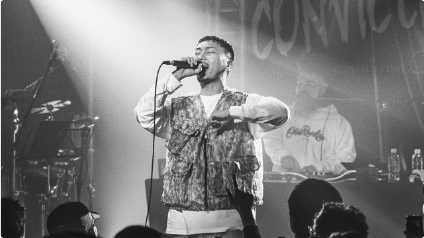 Graphic of a typography specimen showing the alphabet and numerals on top of a dark gray background.